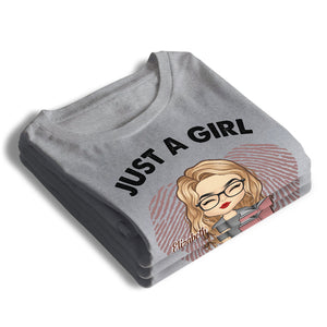 Une fille qui aime les livres - T-shirt et sweat à capuche unisexe personnalisé